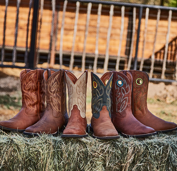 A group of Justin Boots sitting next to each other: Canter 11" Western boot in brown, Canter 11" Western boot in brown, Bowline 11" Western boot in brown.