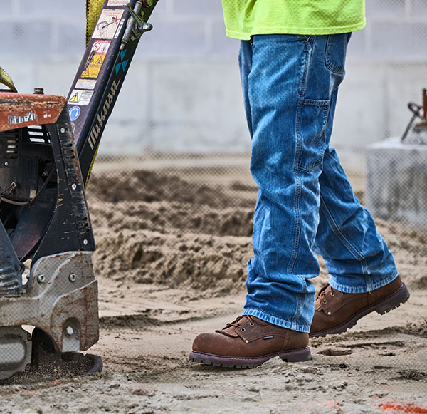 A man wearing the 28 Series 6" Composite Toe Waterproof Work Boot in brown.